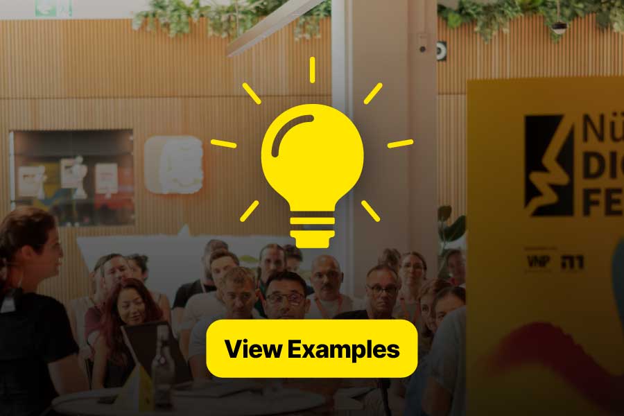 People seated in an event space, with a large yellow light bulb icon overlaid in the foreground. Below it, a yellow button with black text: “View Examples.” On the right, a yellow poster with the Nürnberg Digital Festival logo.